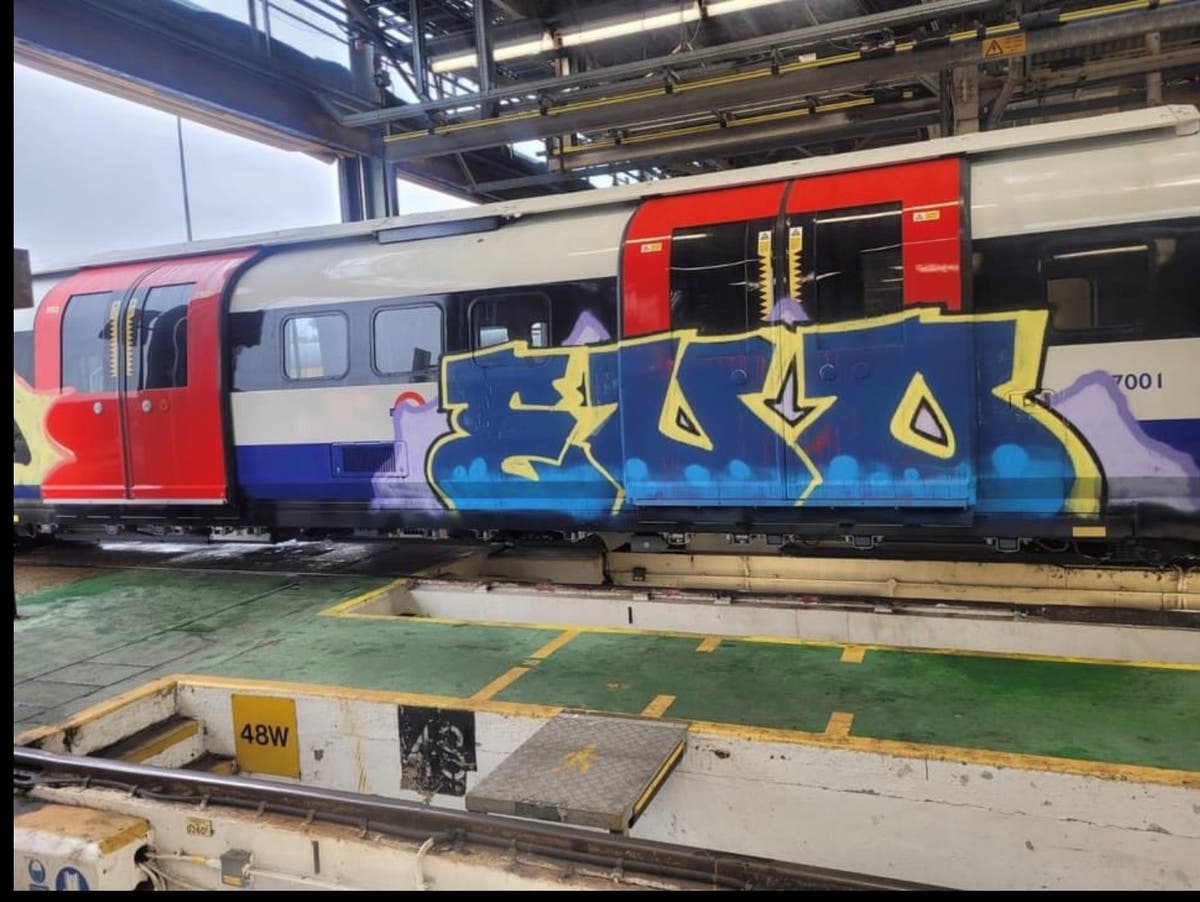 First new Piccadilly line train is covered in graffiti as it arrives in London