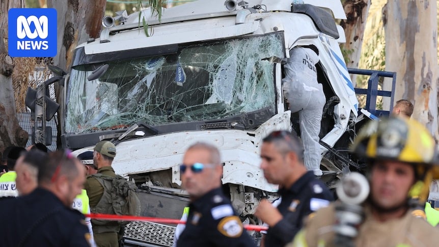 One killed, dozens injured after truck strikes crowded bus stop in central Israel in suspected terror attack