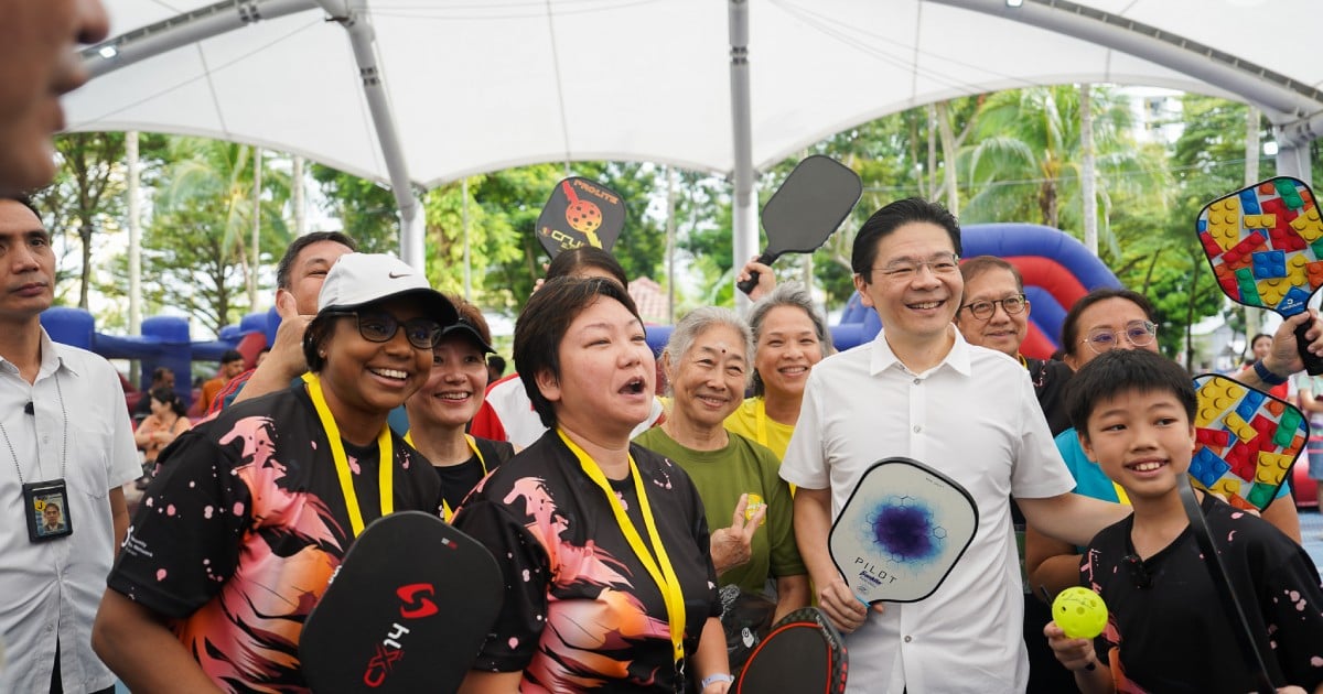 PM Lawrence Wong joins Hougang sports event, plays pickleball with 11-year-old