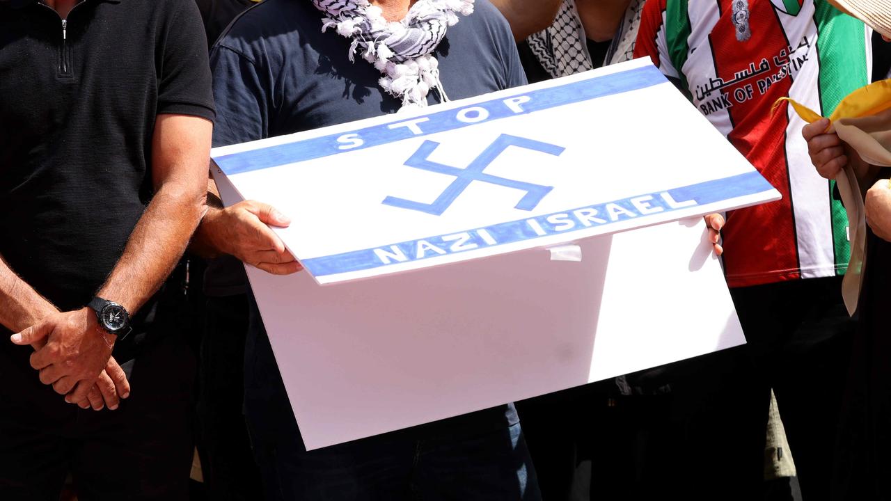 Protester arrested over swastika flag