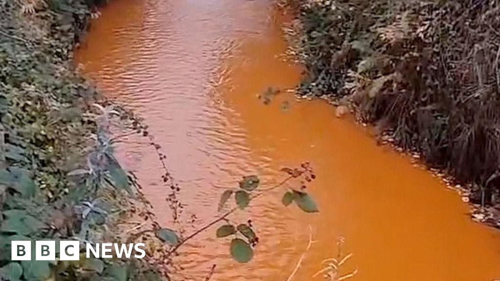 River Calder turned orange by iron deposits in Todmorden