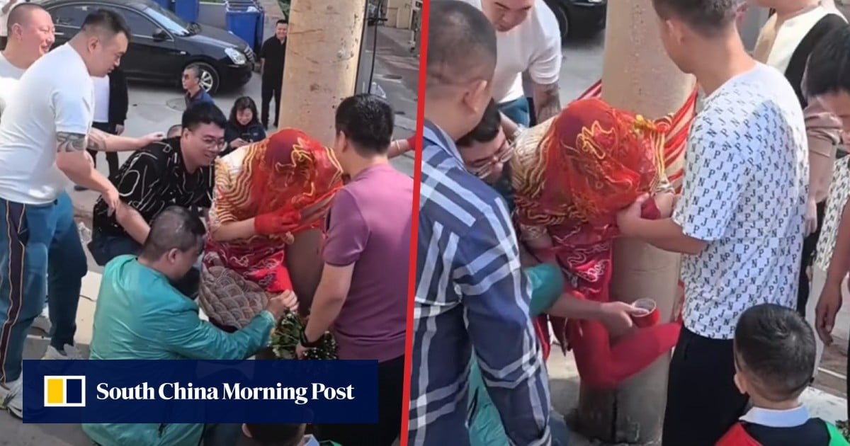 Shock video of China bride taped to phone pole sparks debate over vulgar wedding hazing