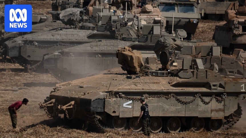 Skirmishes between Israeli troops and Hezbollah reported as tanks mass on Lebanese border