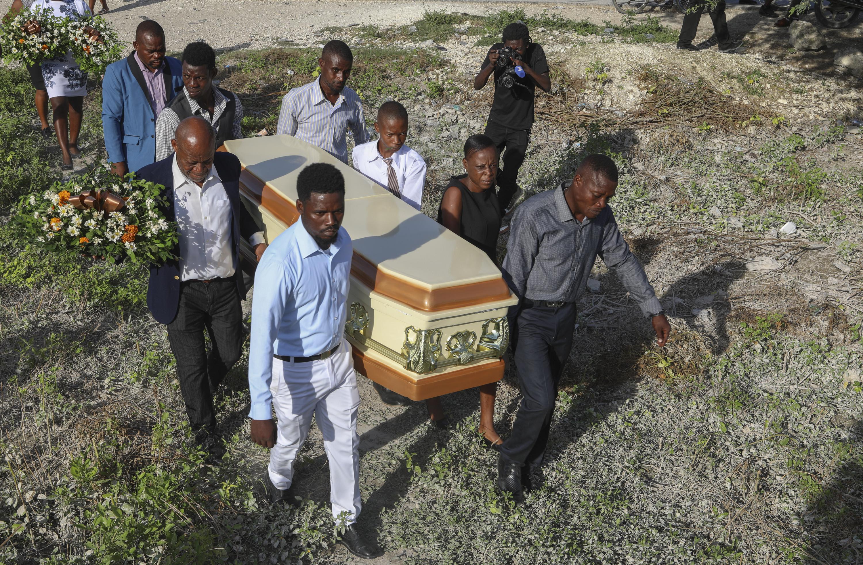 The death toll in a gang attack on a small Haitian town rises to 115, a local official says