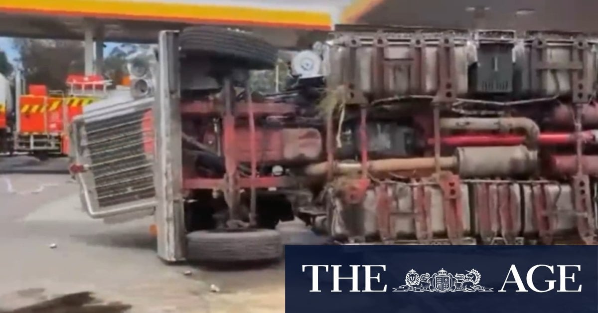 Truck rolls metres from petrol bowsers off major NSW highway