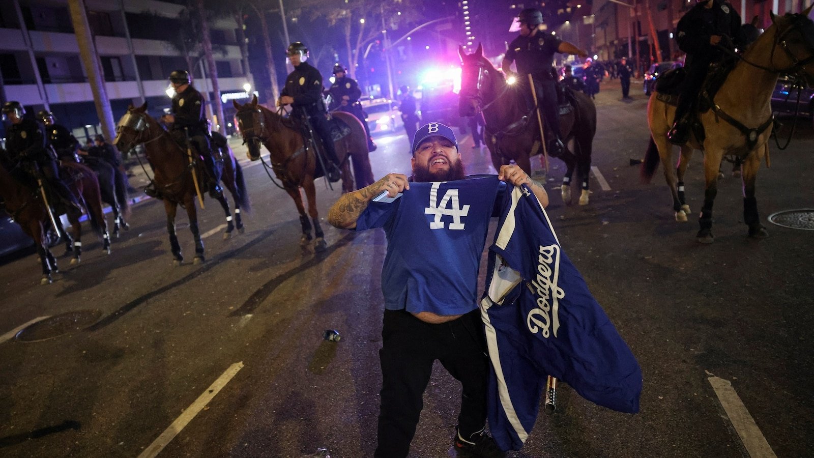 Police clash with 'hostile' fans in Los Angeles after Dodgers win World Series