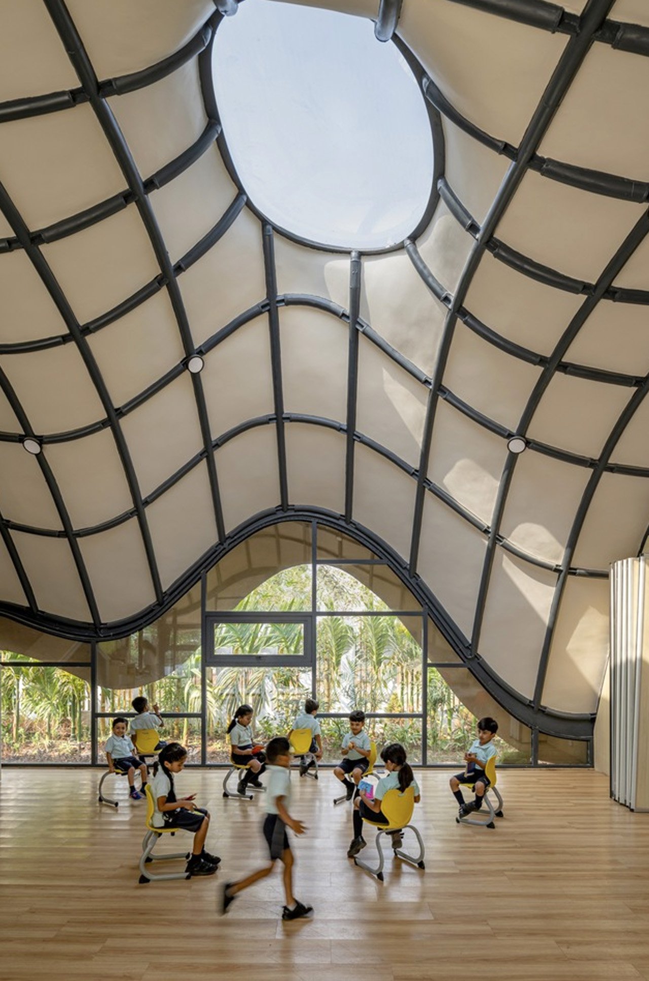 This School In India With An Undulating Green Roof & Sunken Courtyard Is A Relief From Boxy Classrooms