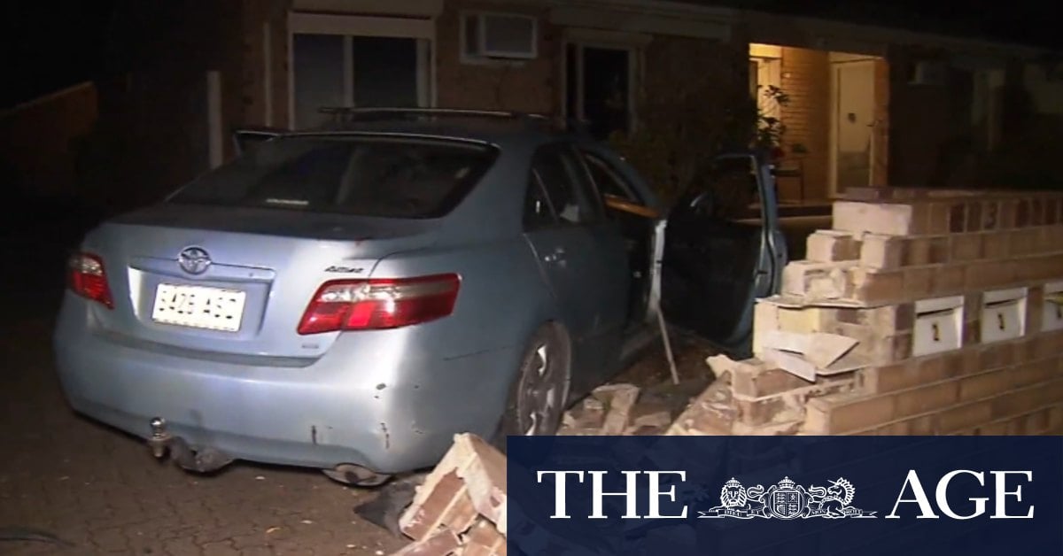 Chaos on Adelaide street after driver crashes into parked car