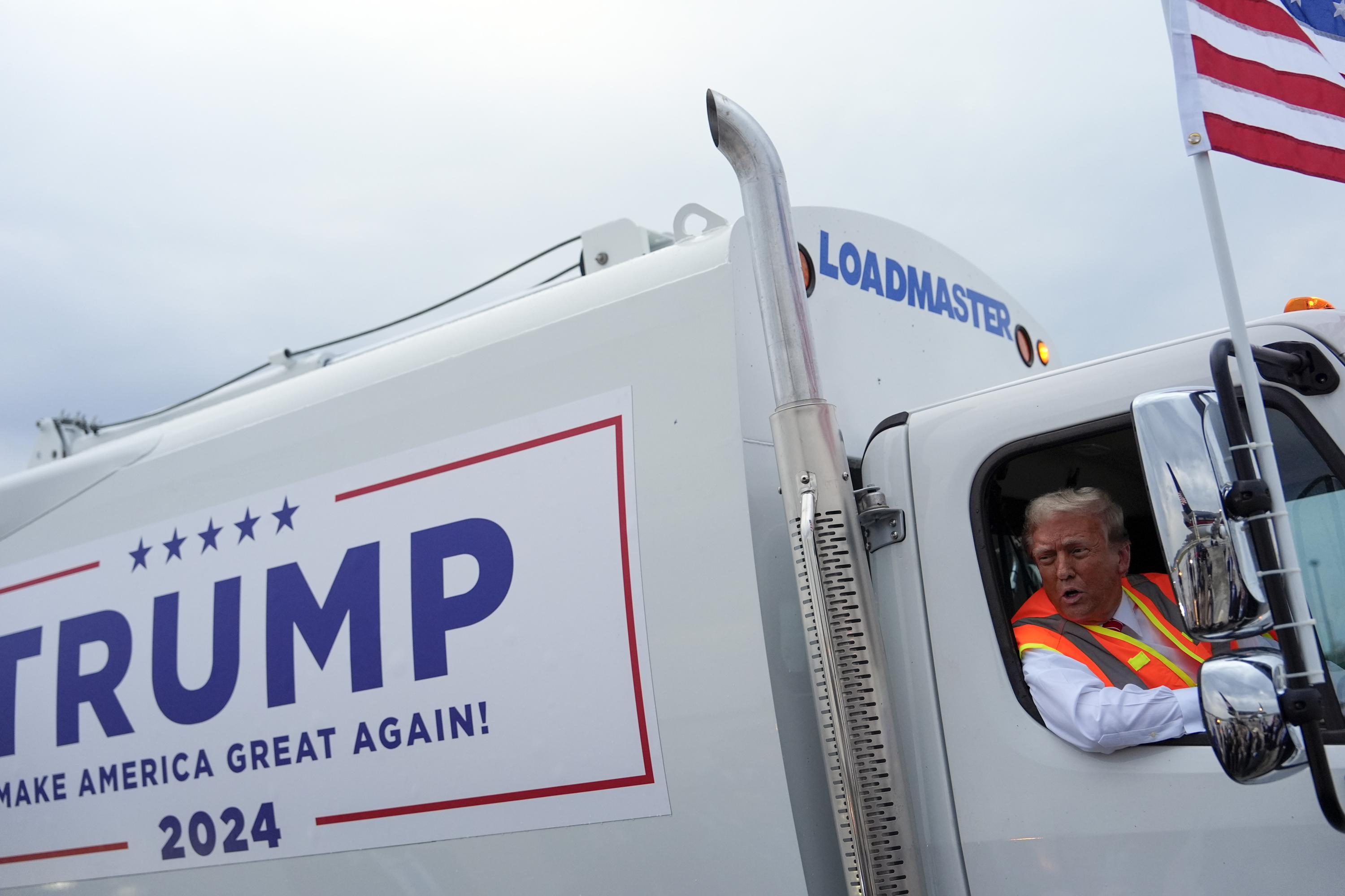 Donald Trump boards a garbage truck to draw attention to Biden remark