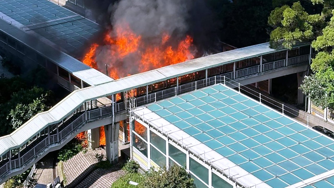 Hong Kong police arrest man, 75, for suspected arson after fire destroys part of road noise barrier