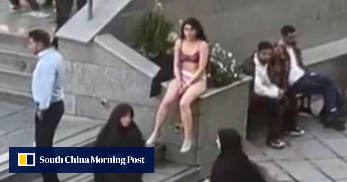 Iran says no charges against student who stripped to her underwear