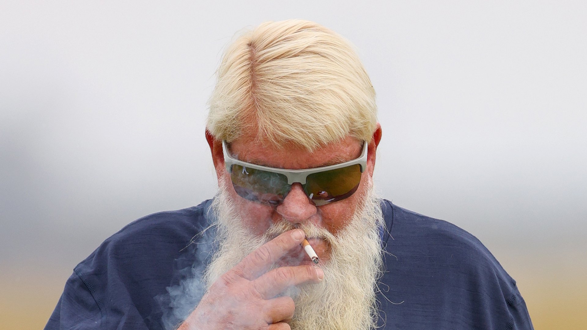 John Daly puffs cigarette in very bold outfit as he practices at Royal Troon ahead of The Open