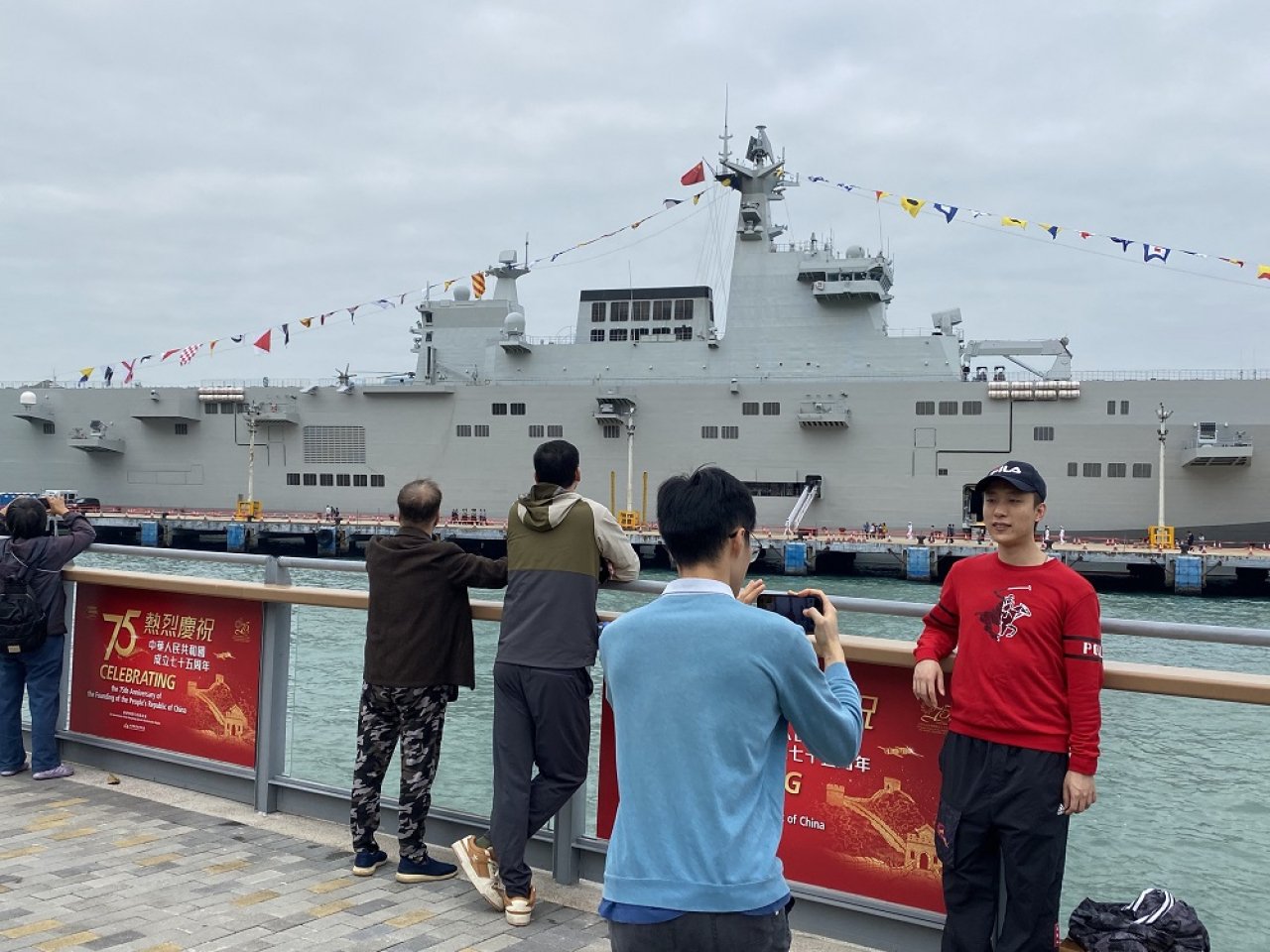 People gather to see PLA Navy ships