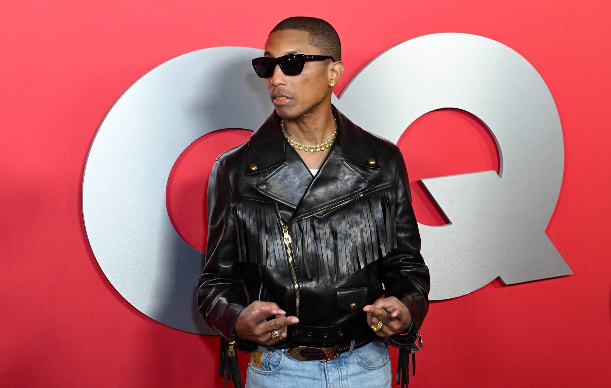 Pharrell Williams heckled by animal protesters, offers them a hug