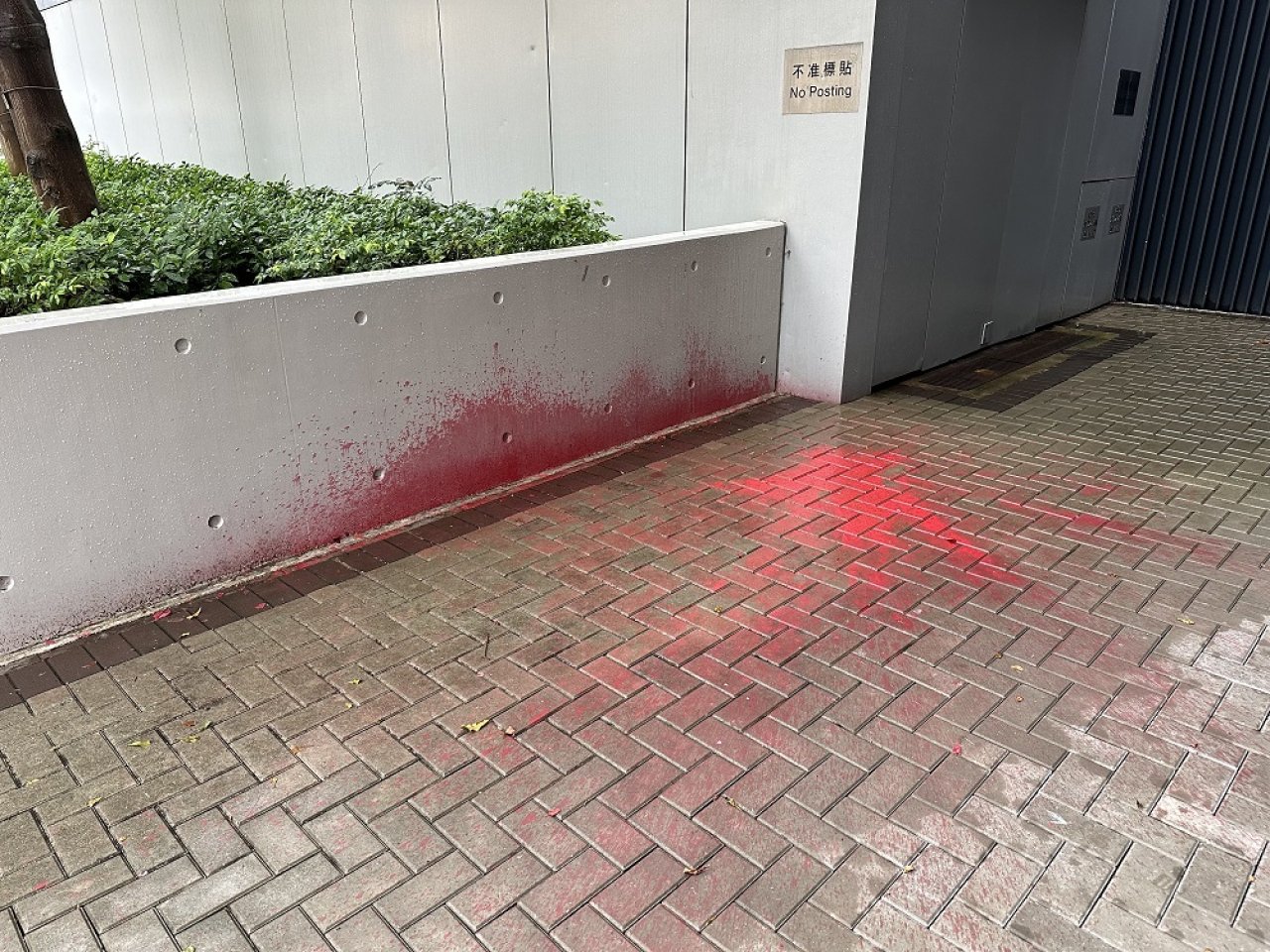 Red paint splashed outside government offices