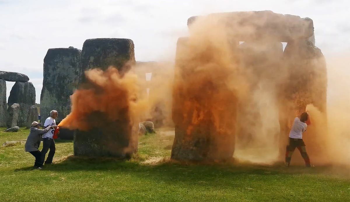 Two charged after orange paint powder thrown over Stonehenge in Just Stop Oil protest 