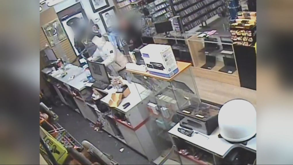 Video shows shotgun pointed at staff during pawn shop robbery