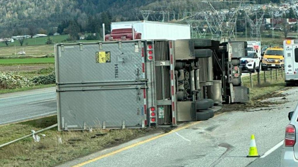 Video shows transport truck toppling over on B.C. highway during windstorm