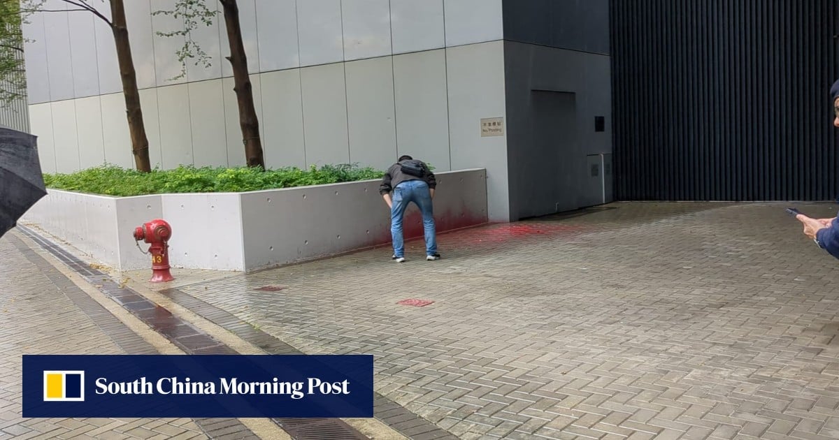 Woman arrested after red paint splashed at government headquarters in Hong Kong