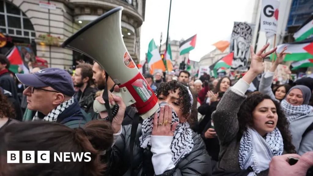 Pro-Palestinian demonstrators march through London