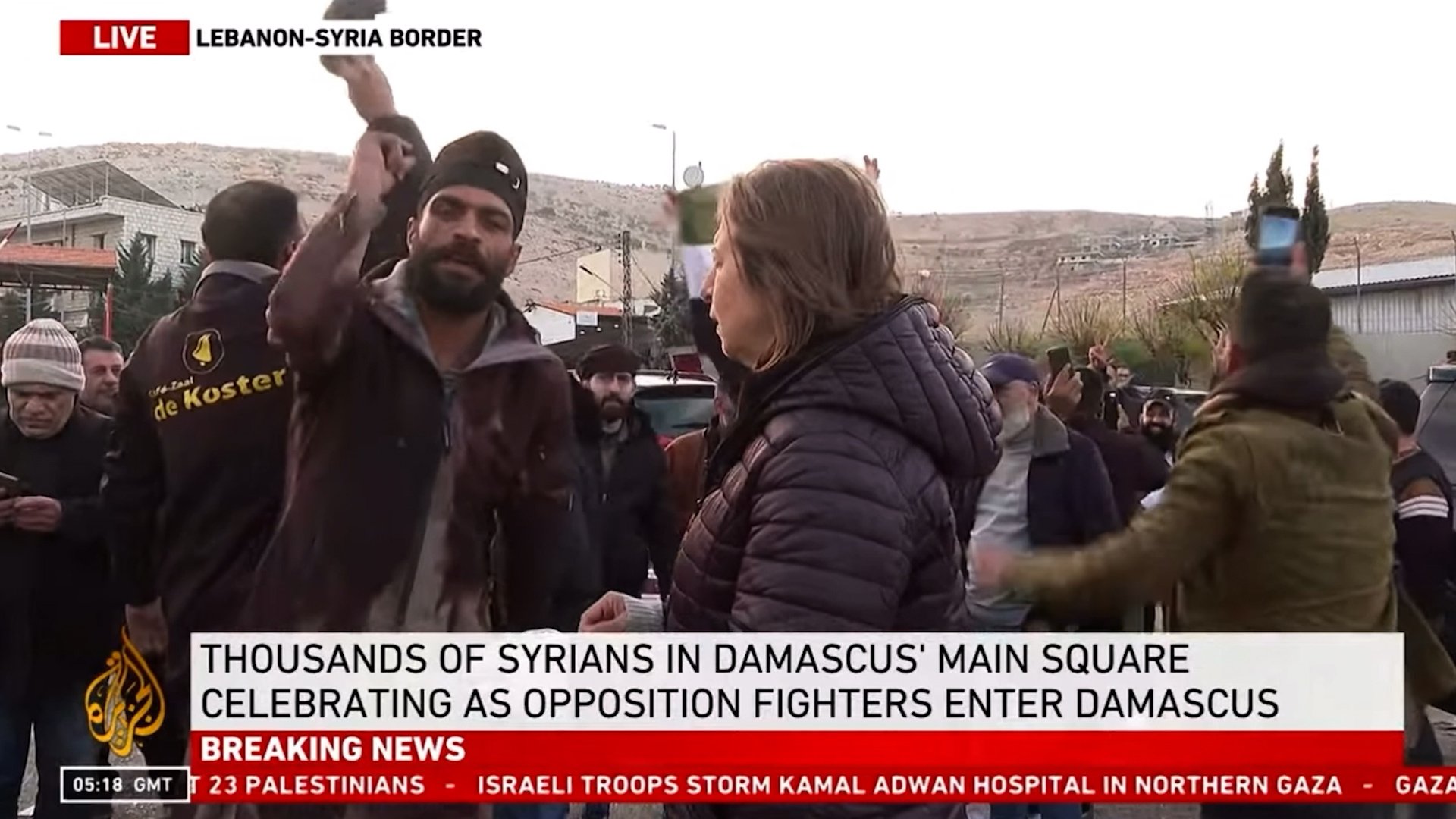 Overjoyed Syrian opposition supporters interrupt Al Jazeera live report