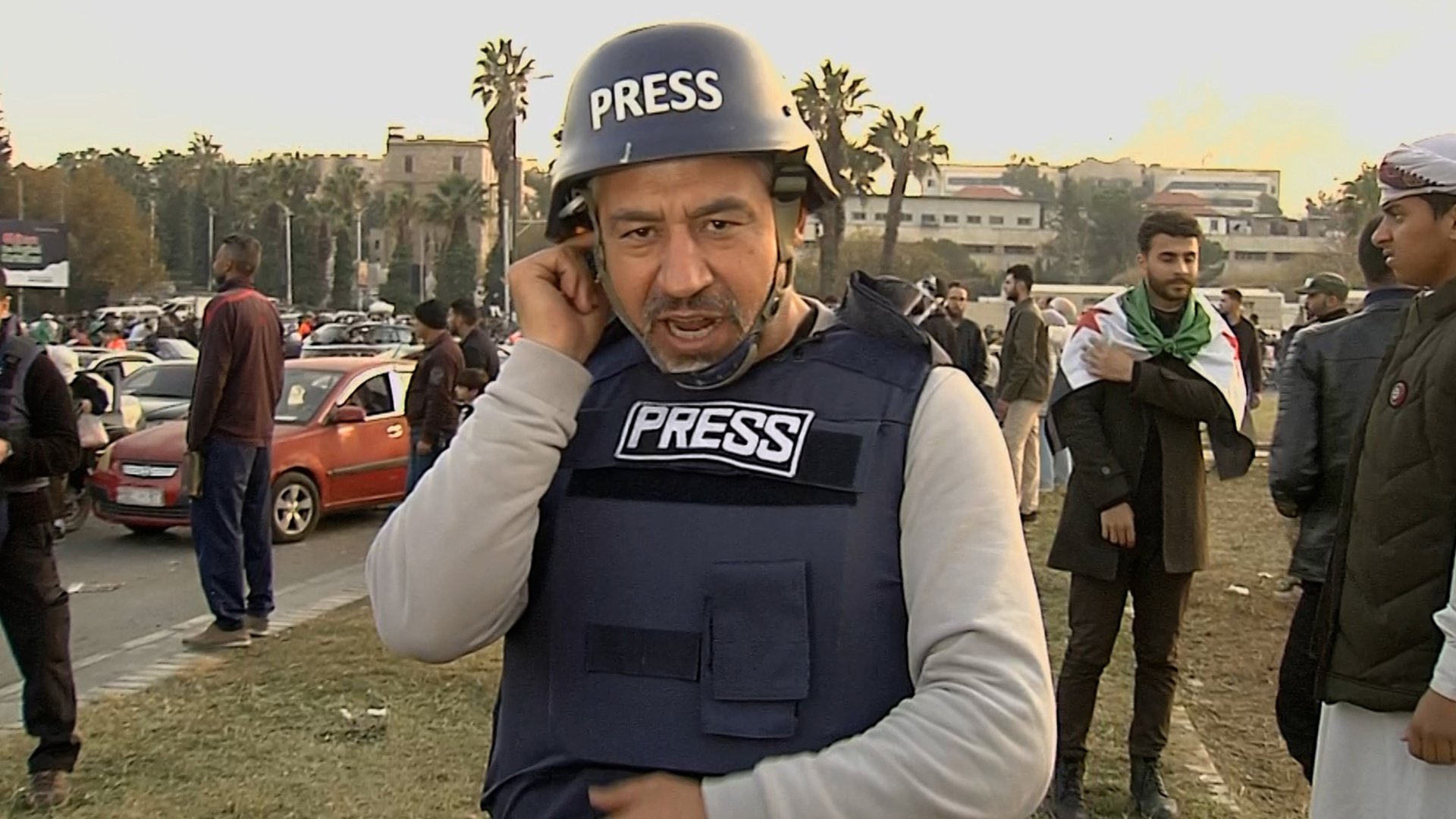 Al Jazeera reporter nearly drowned out by celebrations in Damascus