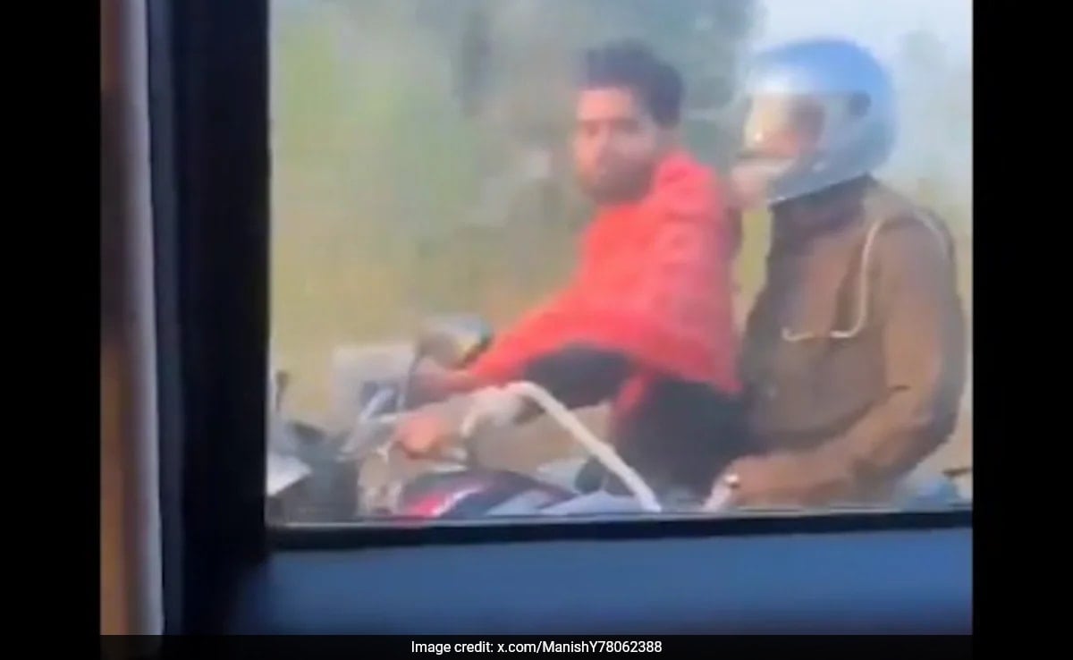 Watch: Handcuffed, Helmetless Criminal Rides Bike As Cop Sits Pillion