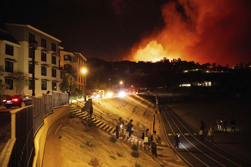 Wildfire explodes in Malibu...