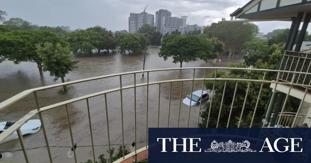 Brisbane residents issued flood warning as storms batter south-east