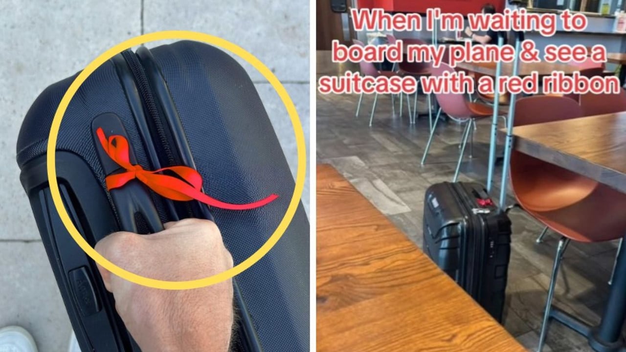 Hidden meaning of red ribbon on suitcase