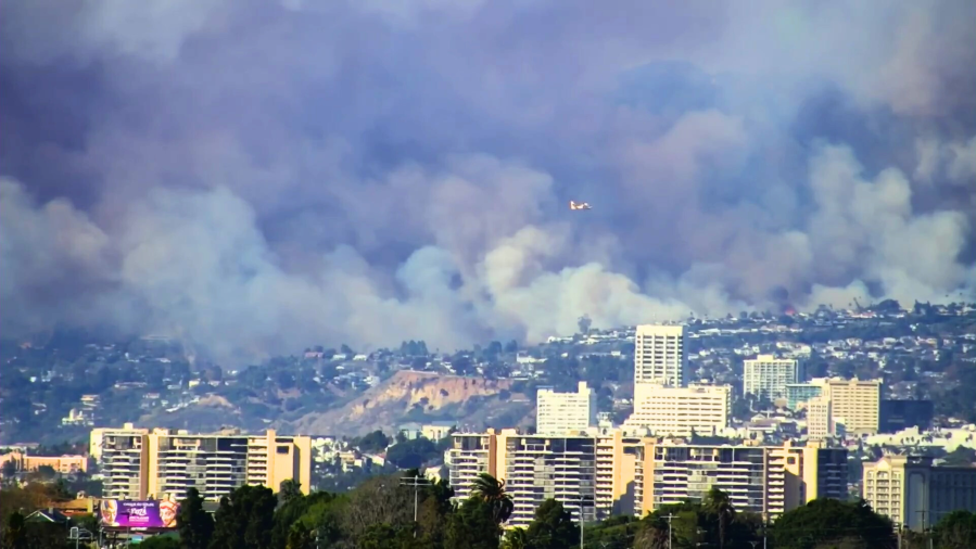 Photos: Rapidly spreading Palisades Fire torches hillsides, threatens homes in Los Angeles