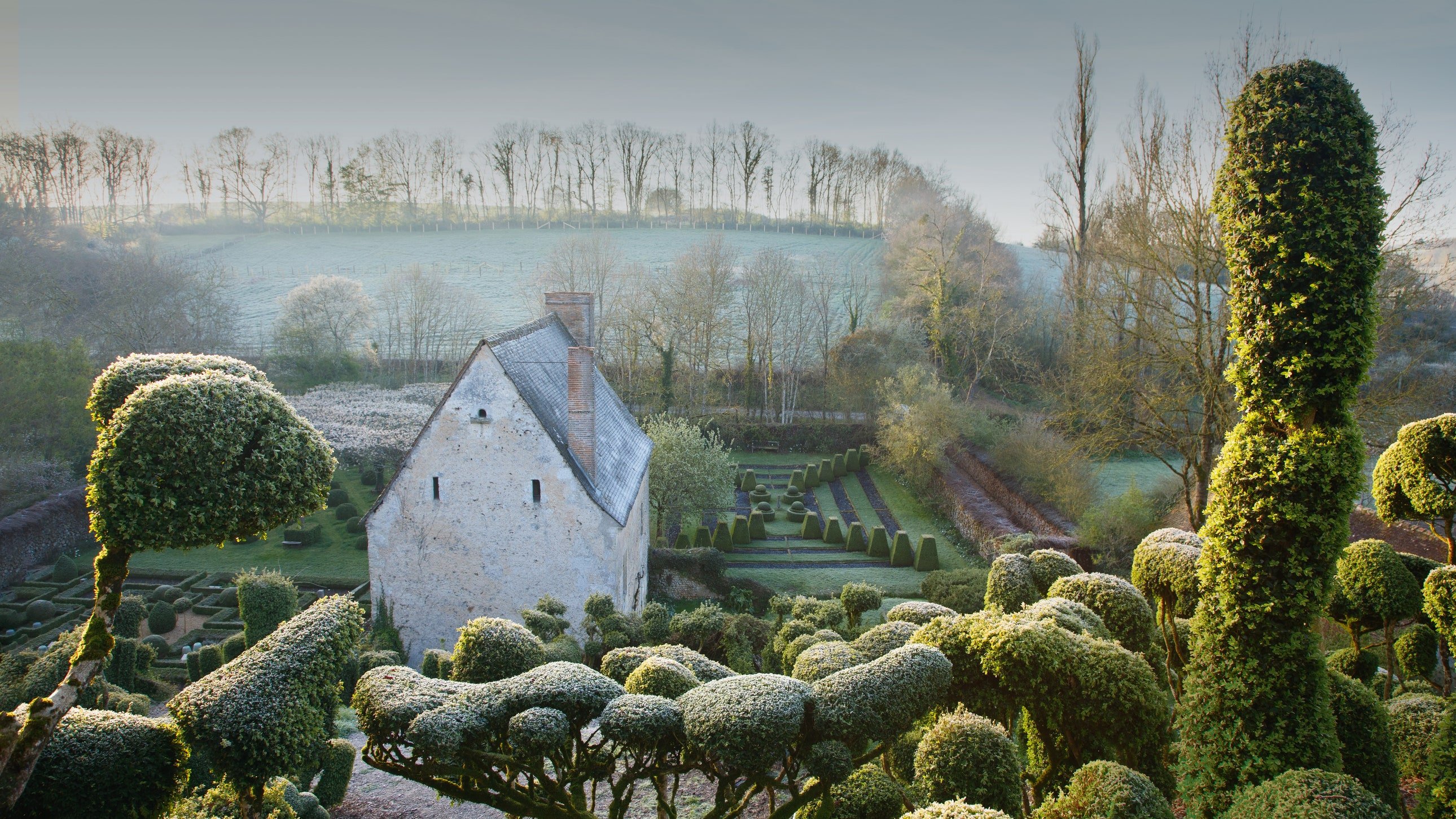 17th-century priory in France converted into a medieval-inspired topiary garden