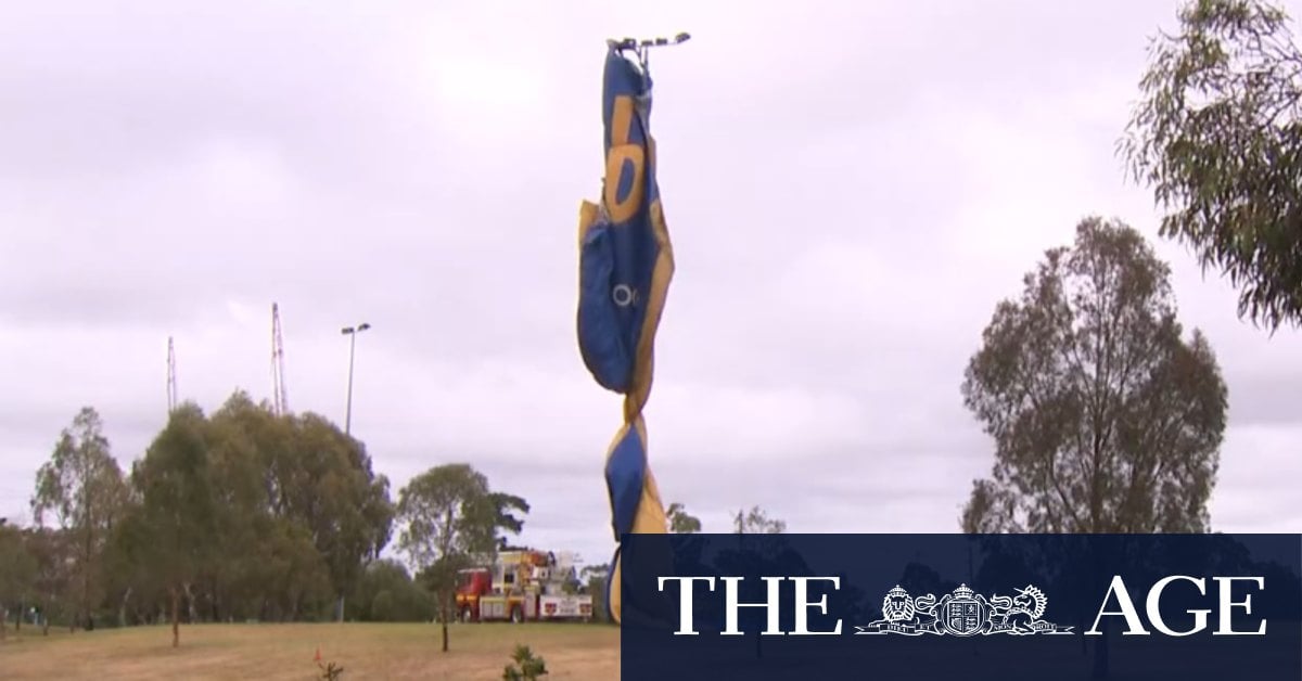 Hot air balloon wraps around lighting tower in Melbourne