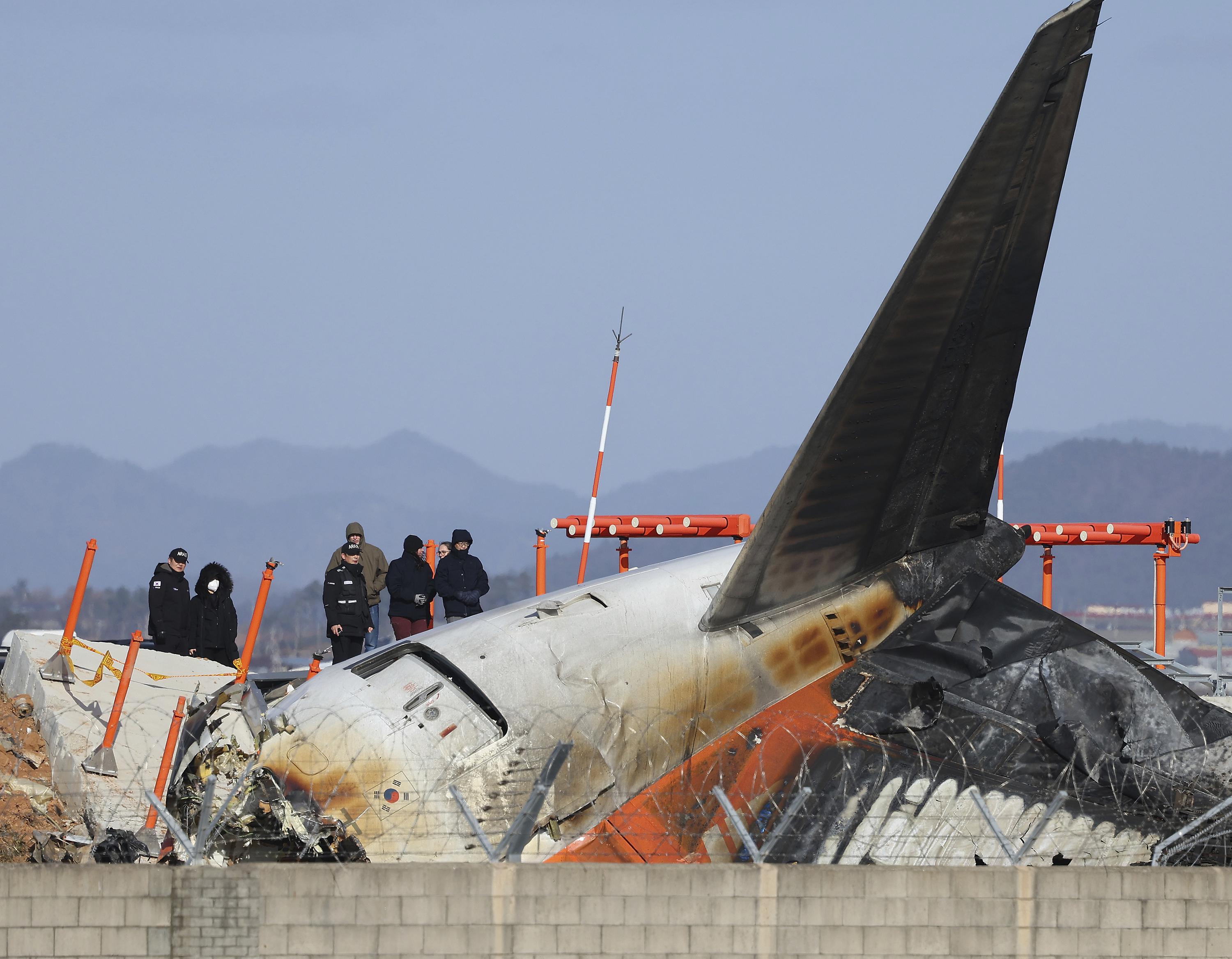 US and Boeing investigators examine the site of a deadly South Korean plane crash