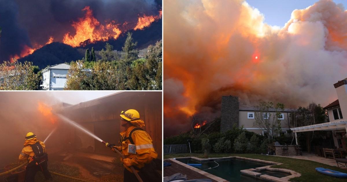 Wildfire rips through upscale coastal community as 20,000 residents evacuate